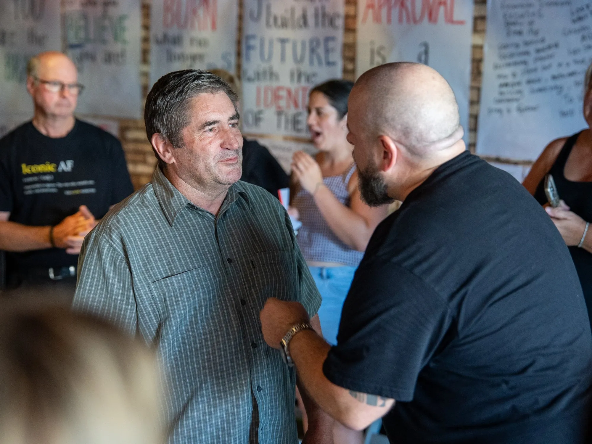 Brett in a one-to-one coaching conversation with a smiling participant
